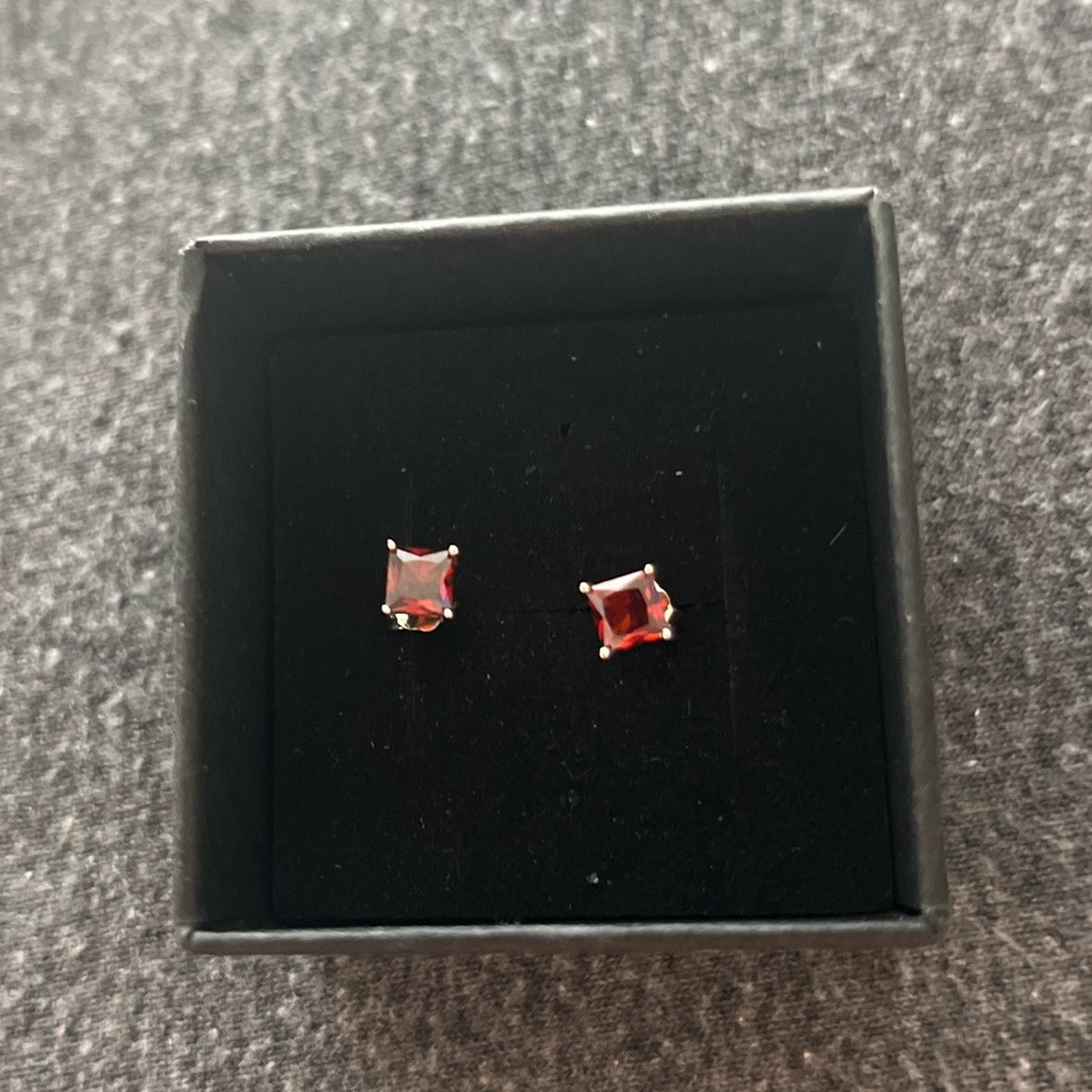 Sterling Silver red stone post earrings.